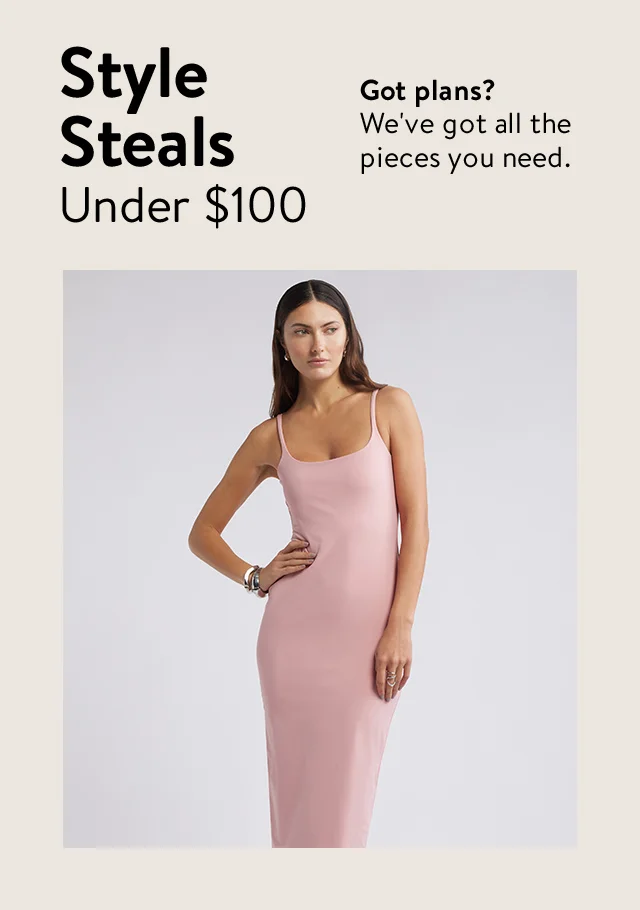 A woman wearing a pink midi dress.