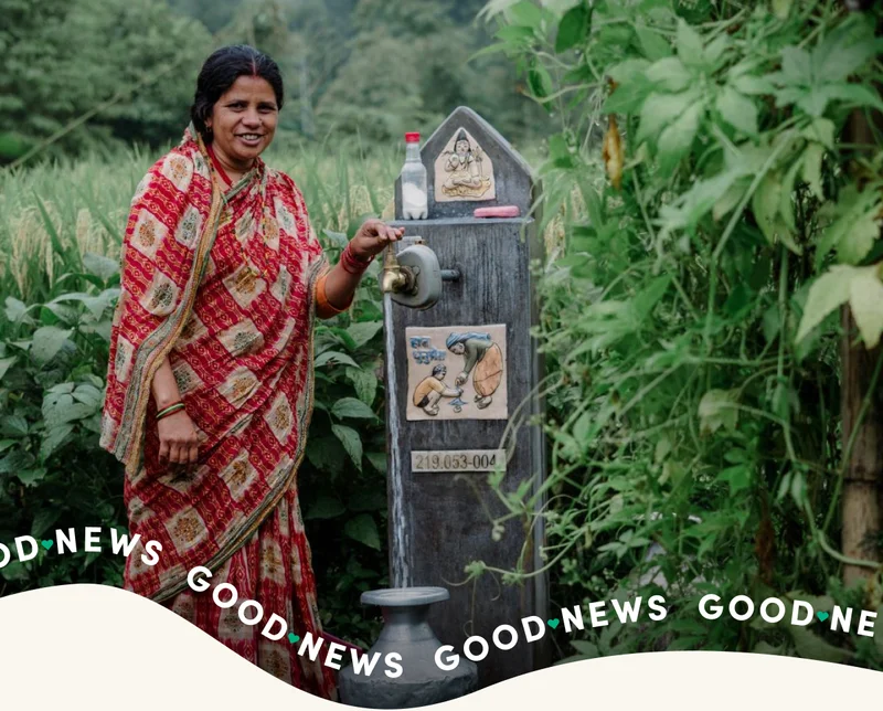 A woman fills up a jerry can with water in Nepal.