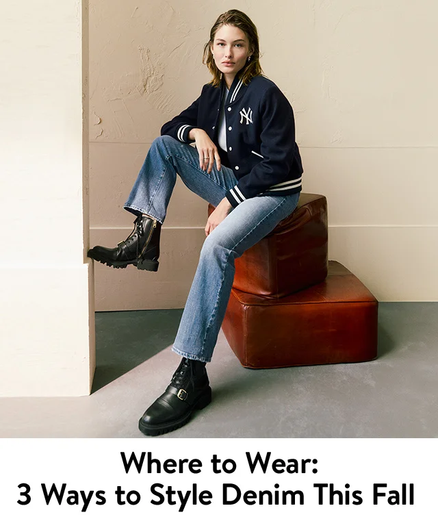 Model wearing AG jeans, a Sporty & Rich varsity jacket and AllSaints boots.