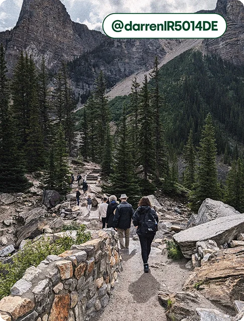 Image description: Travelers hiking on a stepped trail near Moraine Lake, photo taken by @darrenlR5014DE