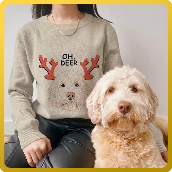 girl sat with her golden doodle while wearing a beige custom christmas pet face sweater