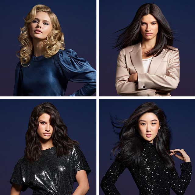Four models with hair styled using Dyson products.