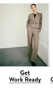 A woman wearing a brown suit.