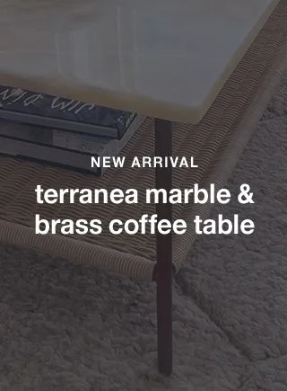 terranea onyx marble and brass metal 54" rectangular coffee table with wicker shelf