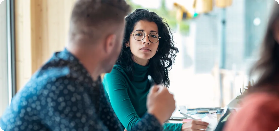 Two people having a discussion in an office