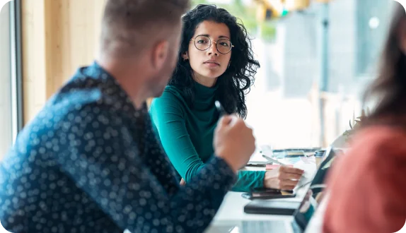 Two people having a discussion in an office