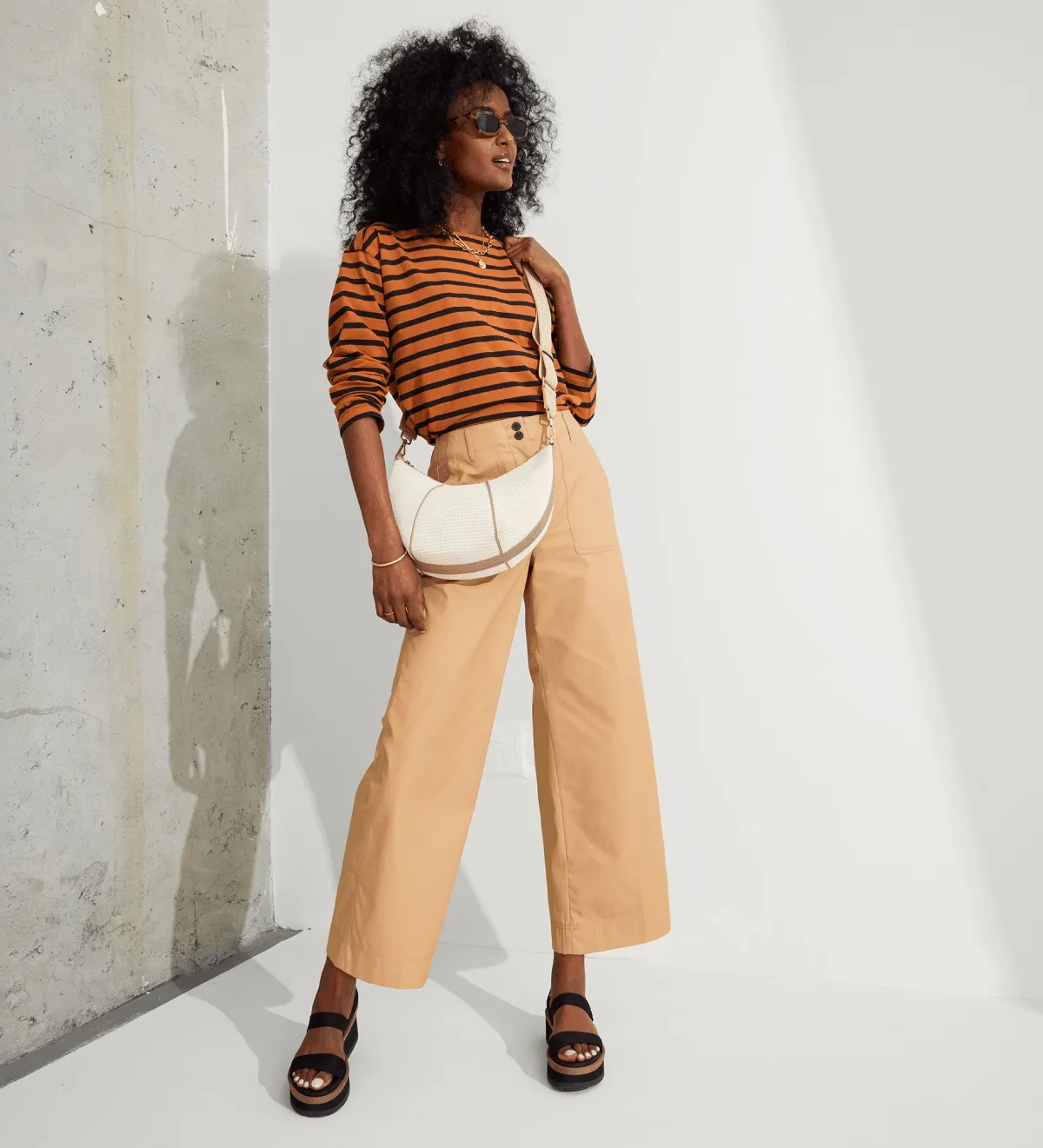 Wear it your way. Get The Crossbody Strap for free with a $250+ purchase.