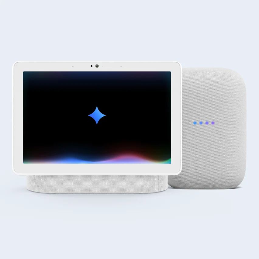 White smart display next to a gray smart speaker with colored indicator lights.
