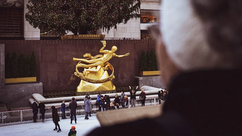 Image description: People ice skating at the rink at Rockefeller Center in New York.