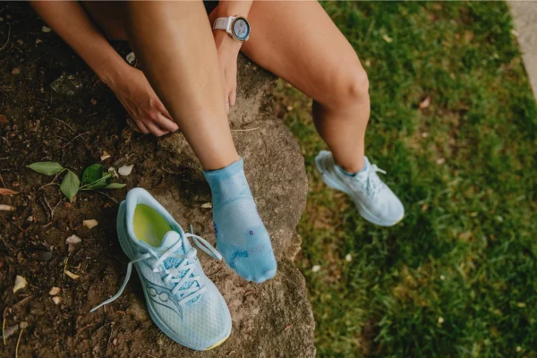 Woman wearing socks and saucony shoes