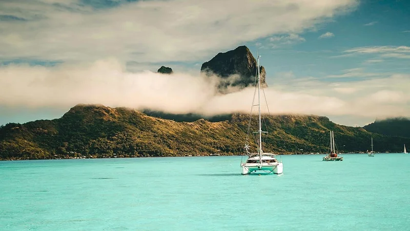 Image description: Boat sailing in Bora Bora.