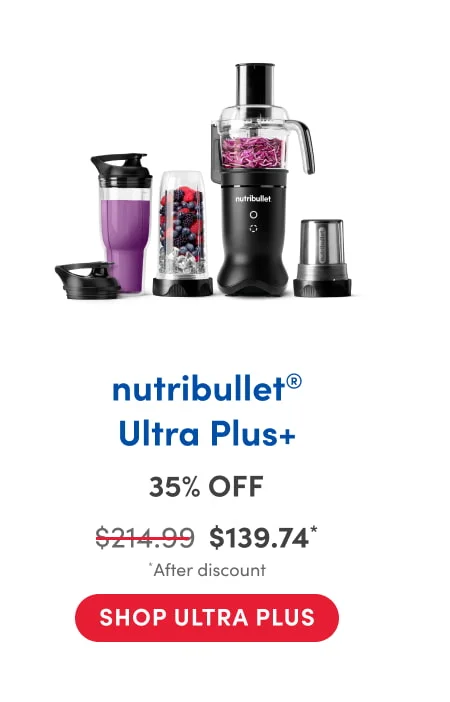 A nutribullet appliance set lined up on a white background, featuring a black base motor with attachments for blending and food processing. The set includes a tall blending cup filled with purple smoothie, a blending cup with mixed berries and ice, a food processor bowl with shredded cabbage, a grinding blade cup, and matching travel lids.