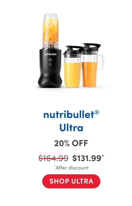A nutribullet blender filled with orange slices, lemon, and ice, shown next to two travel cups filled with orange juice or smoothies, each with a black flip-top lid; one cup has a handle.