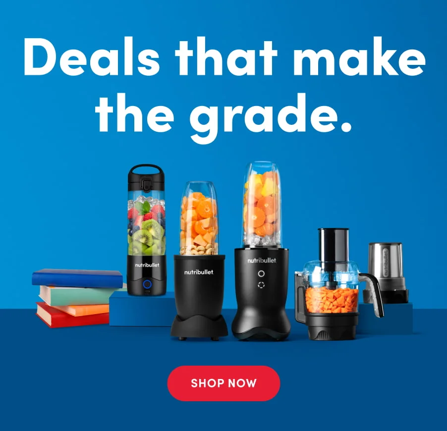 A vibrant blue background showcases five different nutribullet blenders and food processors, some filled with colorful chopped fruits and vegetables. The appliances are arranged alongside a stack of books
