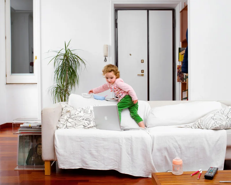 A young child watches cartoons on a laptop at home. New research shows it’s not just about how much screen time kids use—it’s about what they watch, how they watch, and why it matters.