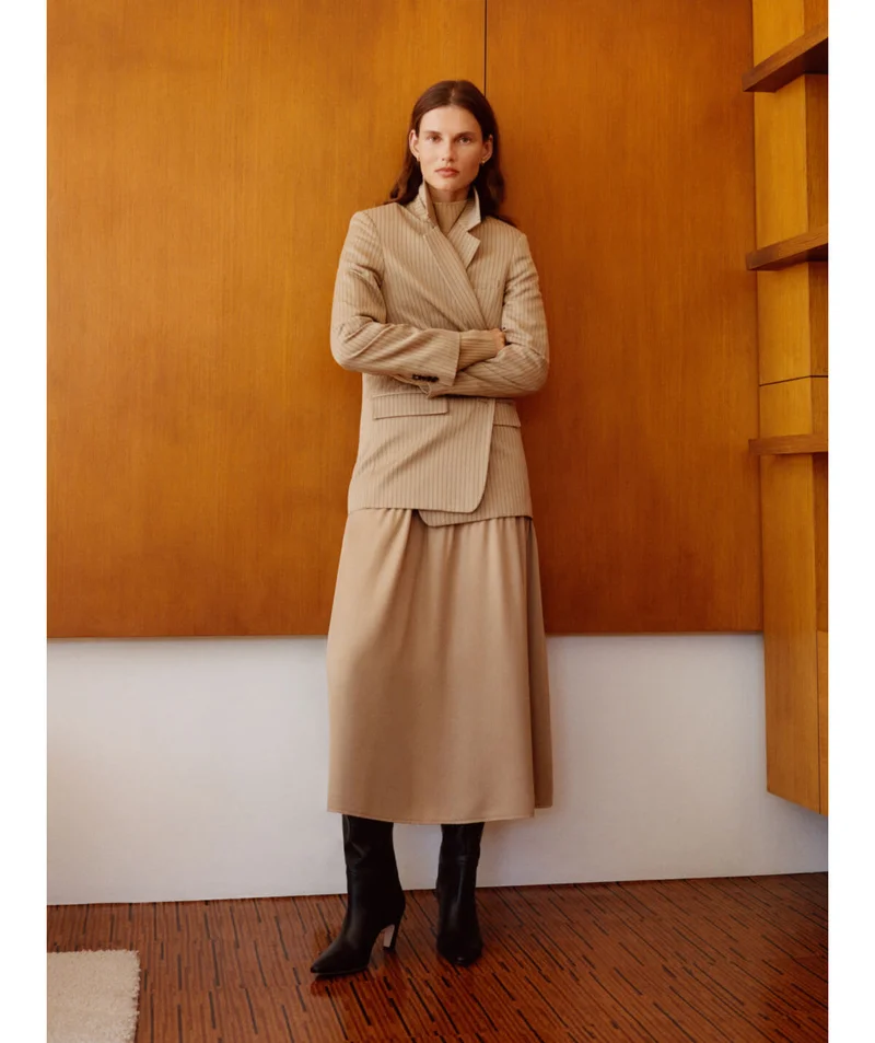 [image]The TENCEL ™ Oversized Blazer, $198, The Good Merino Wool Mockneck Sweater, $118, and The Knee-High Banana Heel Boot, $350