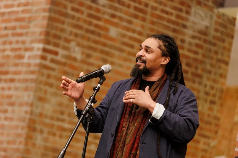 A person speaking into a microphone