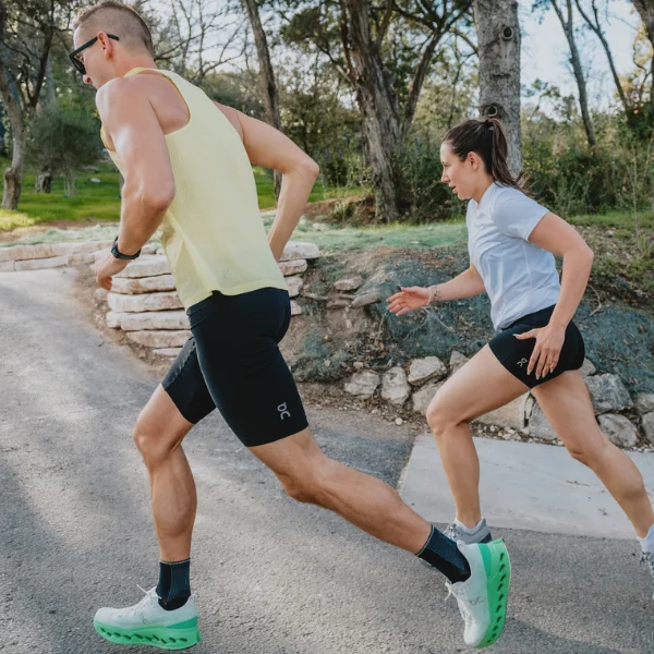 Man and woman wearing On shoes