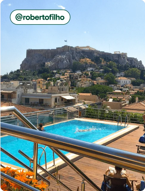 Image description: A view of the Acropolis from the rooftop pool at the Electra Palace Athens, photo taken by @robertofilho