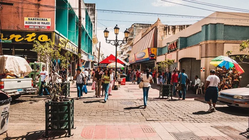 Image description: Tourists shopping in town in the Dominican Republic