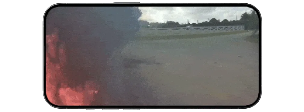 Point of view image showing the start of a wildfire near a road.