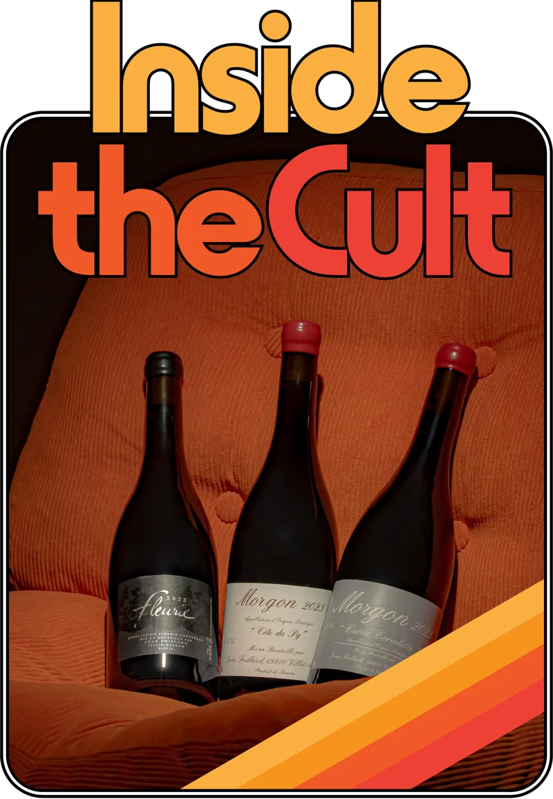 Three Jean Foillard wines sitting snug on a retro orange cord chair.