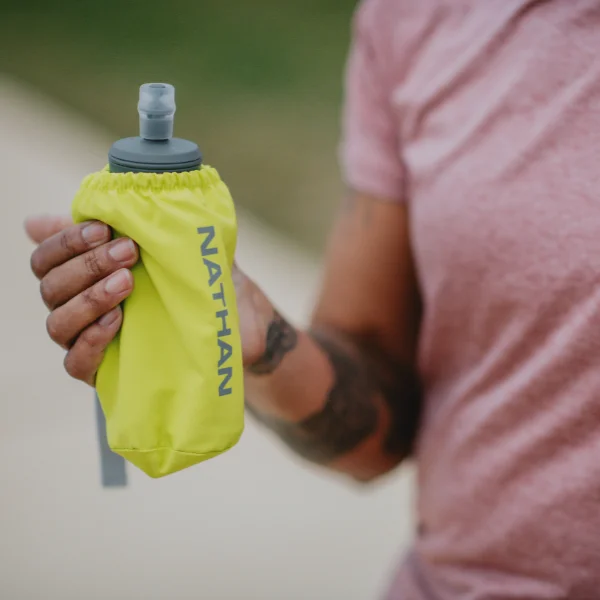 Runner holding a Nathan bottle