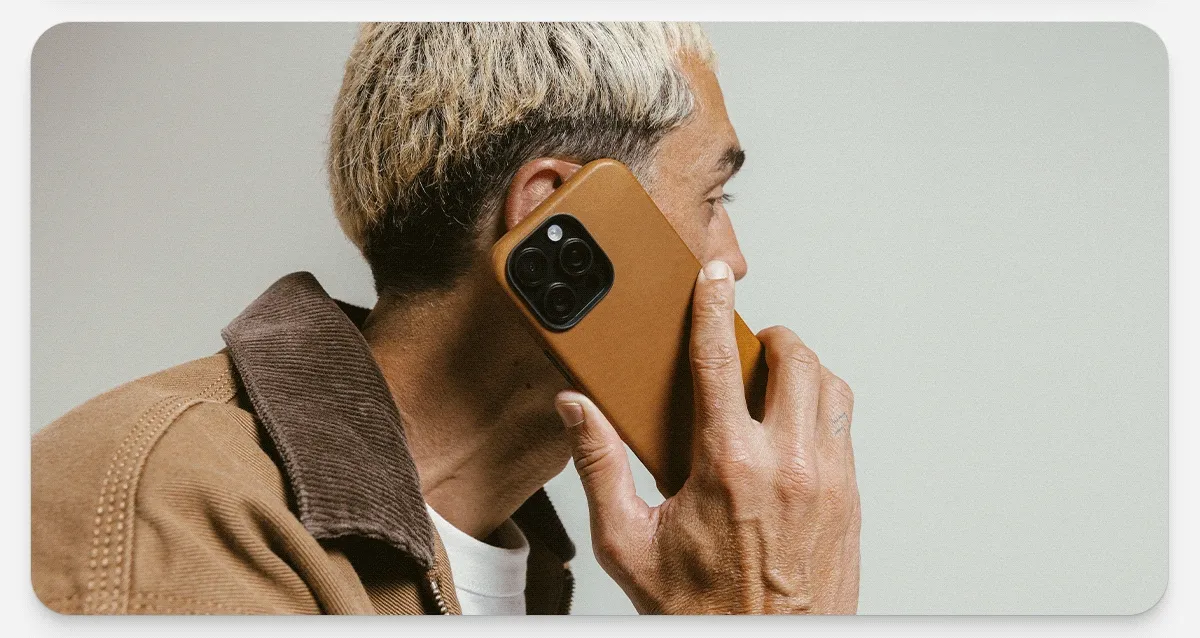 English Tan Traditional Case for iPhone 16 Pro and iPhone 16 Pro Max. Full wrap leather iPhone case. Minimal branded logo, cutout for Camera control, and sleek design.