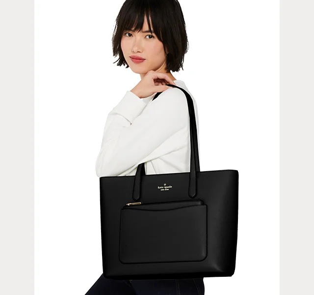 Tote. Wristlet. Pouch. You get all three—great for carrying all essentials. The tote even holds a 13" laptop! Shop Staci