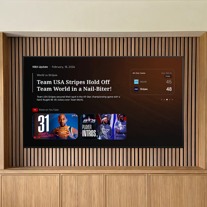 Wall-mounted TV displaying basketball news with a 48-45 game score and video thumbnails.