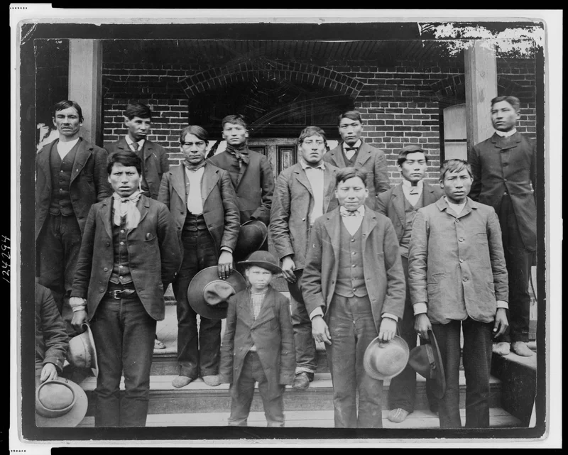 In the 19th and 20th centuries, the U.S. established federally funded Indian Boarding Schools that aimed to strip Native American children of their culture. The Carlisle Indian Industrial School, pictured here, was the most prominent.