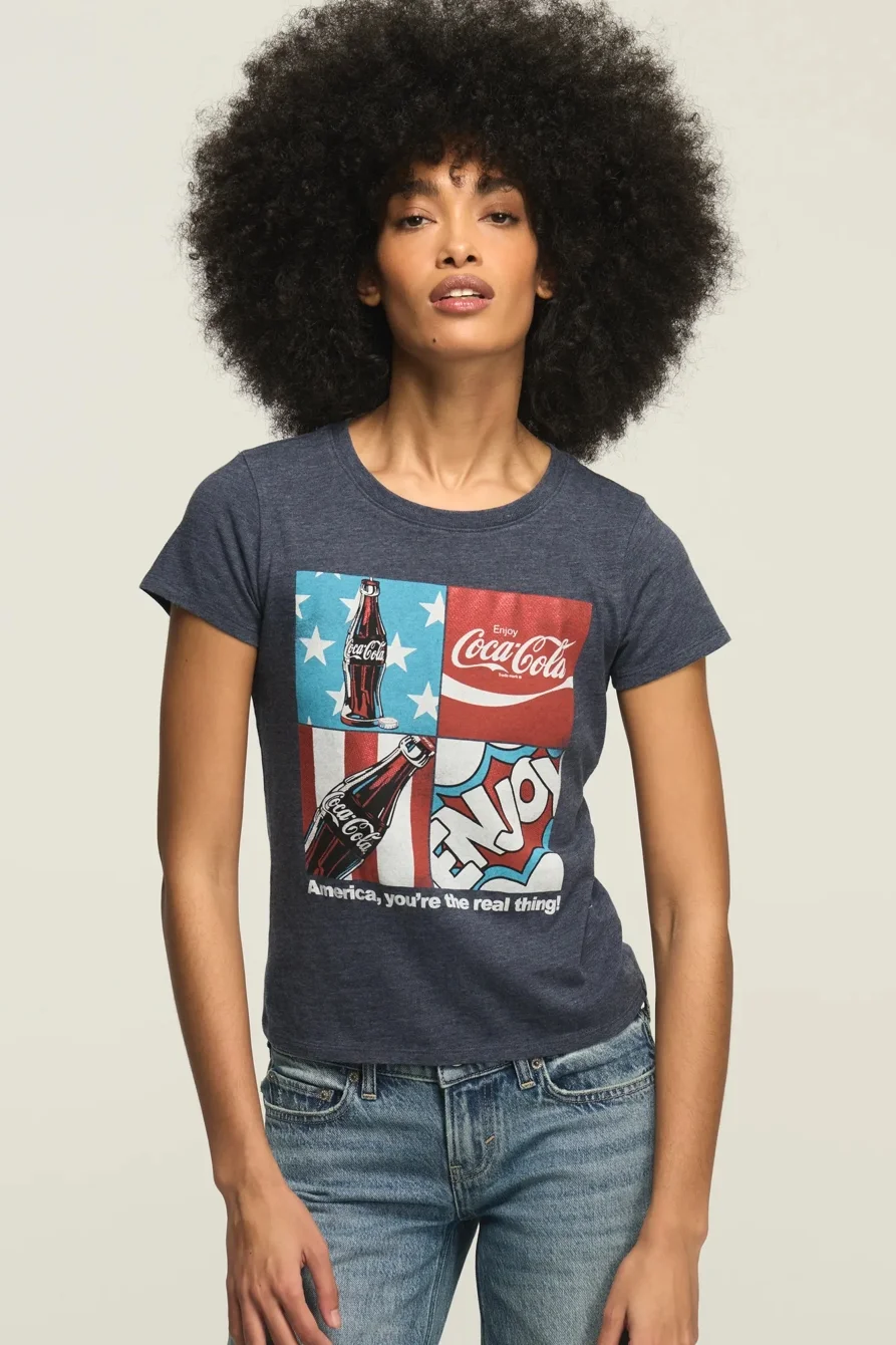 Image of Lucky Brand Coca Cola Americana Grid Baby Tee - Women's Clothing Tops Shirts Tee Graphic T Shirts in Total Eclipse