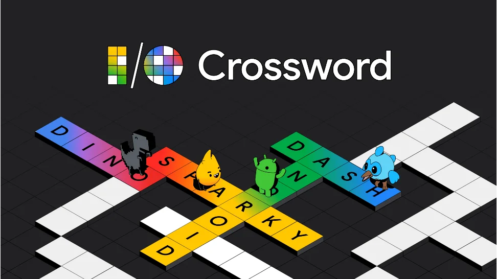 An illustration of The Google developer mascots, including Android, Dino, Sparky, and Dash, stand on the tiles of a crossword puzzle; all tiles are white except rainbow-hued tiles that spell out their names. At the top of the image, it reads “I/O Crossword.”