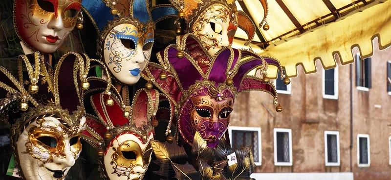 A collection of colorful and intricately designed Venetian carnival masks.