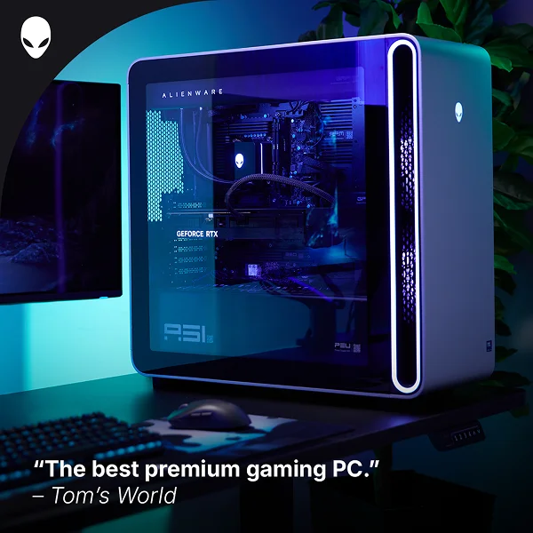 An Alienware Area-51 Gaming Desktop computer in a dramatically lit home office.