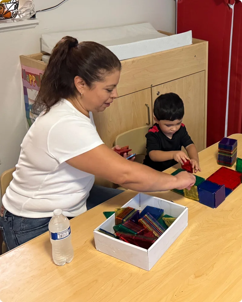 Rosalba and her child playing