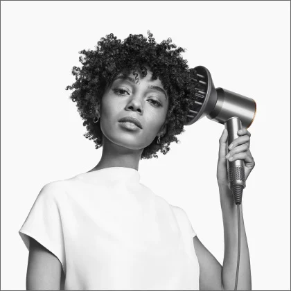 Model using Dyson Supersonic hair dryer