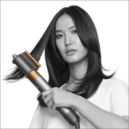 Model using Dyson Airwrap multi-styler