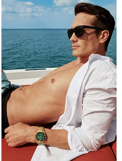 Man by the sea wearing Promaster Dive BN0262-59W