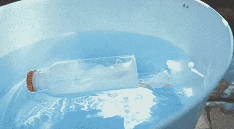 A small plastic bottle boat speeds across a tub of water using baking soda and vinegar.