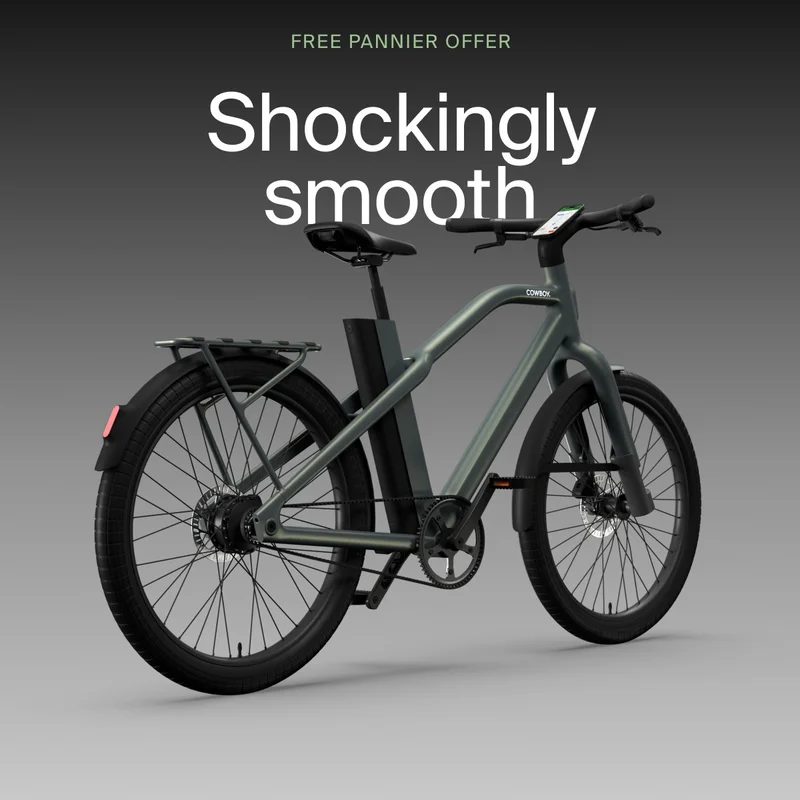 A graphic. Black Friday promotional graphic for a Cowboy cargo e-bike with the text “Go further.”