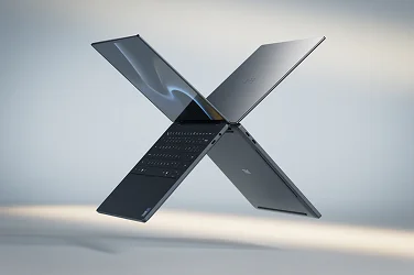 Two Dell XPS laptop computers floating in midair in the shape of the letter “X”.