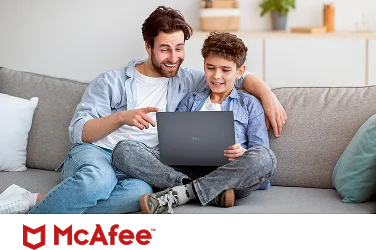 A carefree parent and child on a couch enjoying watching a video on a Dell laptop computer above a McAfee logo.