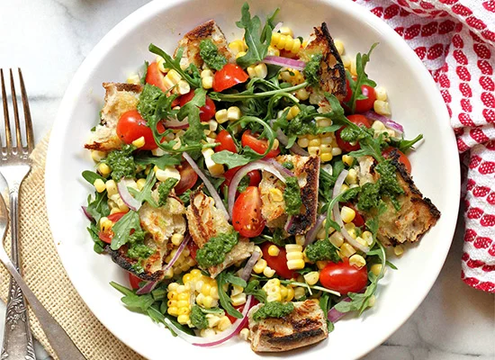 See the Grilled Bread Salad with Charred Corn, Tomatoes, Red Onion, Basil Vinaigrette recipe