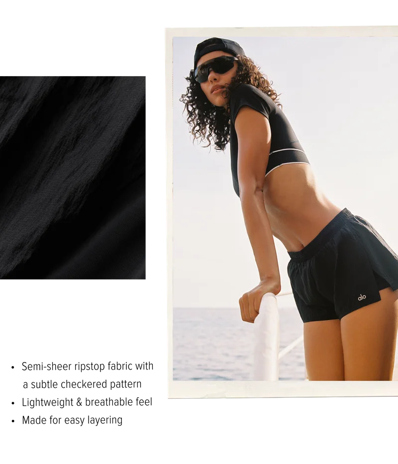 • Semi-sheer ripstop fabric with a subtle checkered pattern • Lightweight and breathable feel • Made for easy layering