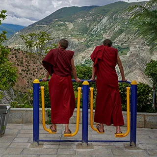 Young Buddhist monks use muscles as well as meditation during their stay at the Dongzhulin Monastery in the mountainous northwest of Yunnan, China.