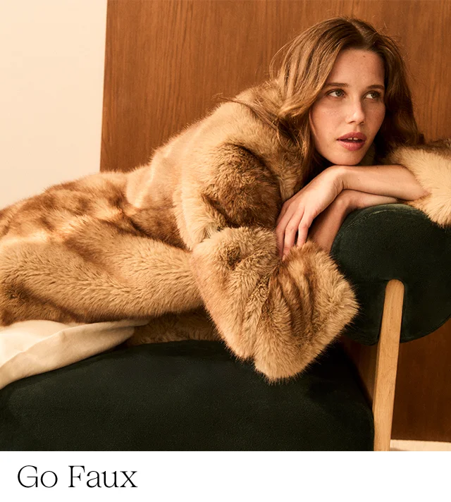 A woman wearing a faux-fur coat.