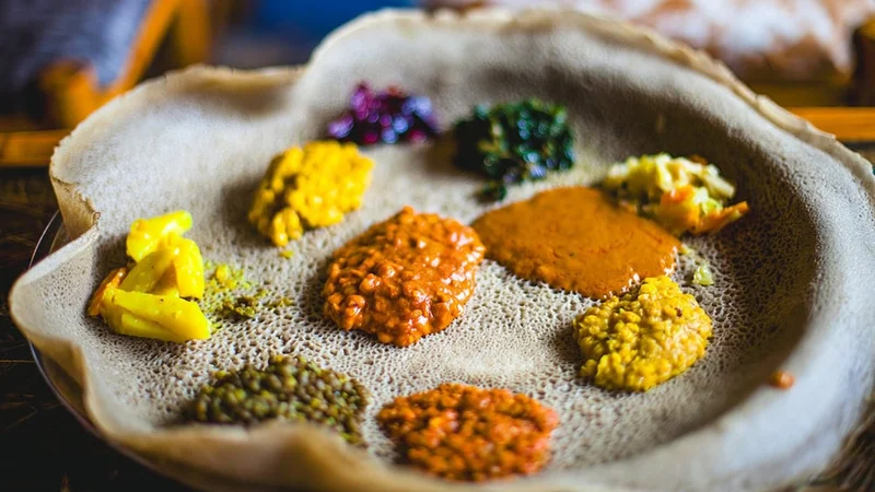 Image description: An Ethiopian combination plate on injera.