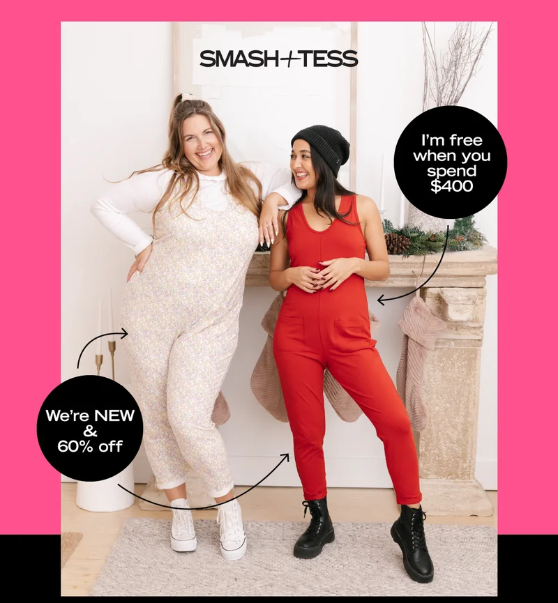 2 women in front of fireplace wearing floral and red rompers