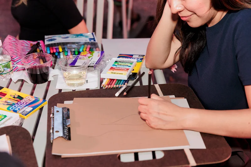 Closeup of visitors making art